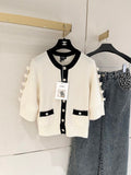 Bow-tie openwork cashmere cardigan with short sleeves