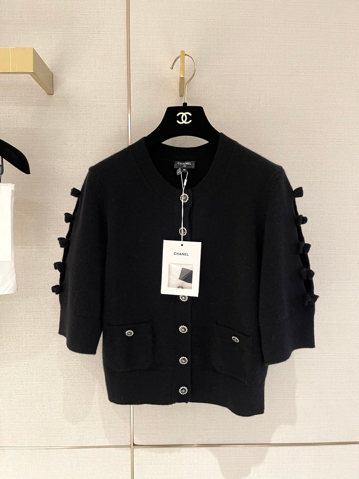 Bow-tie openwork cashmere cardigan with short sleeves