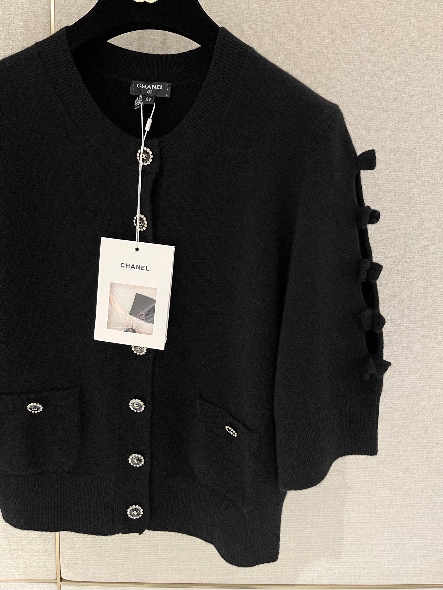 Bow-tie openwork cashmere cardigan with short sleeves