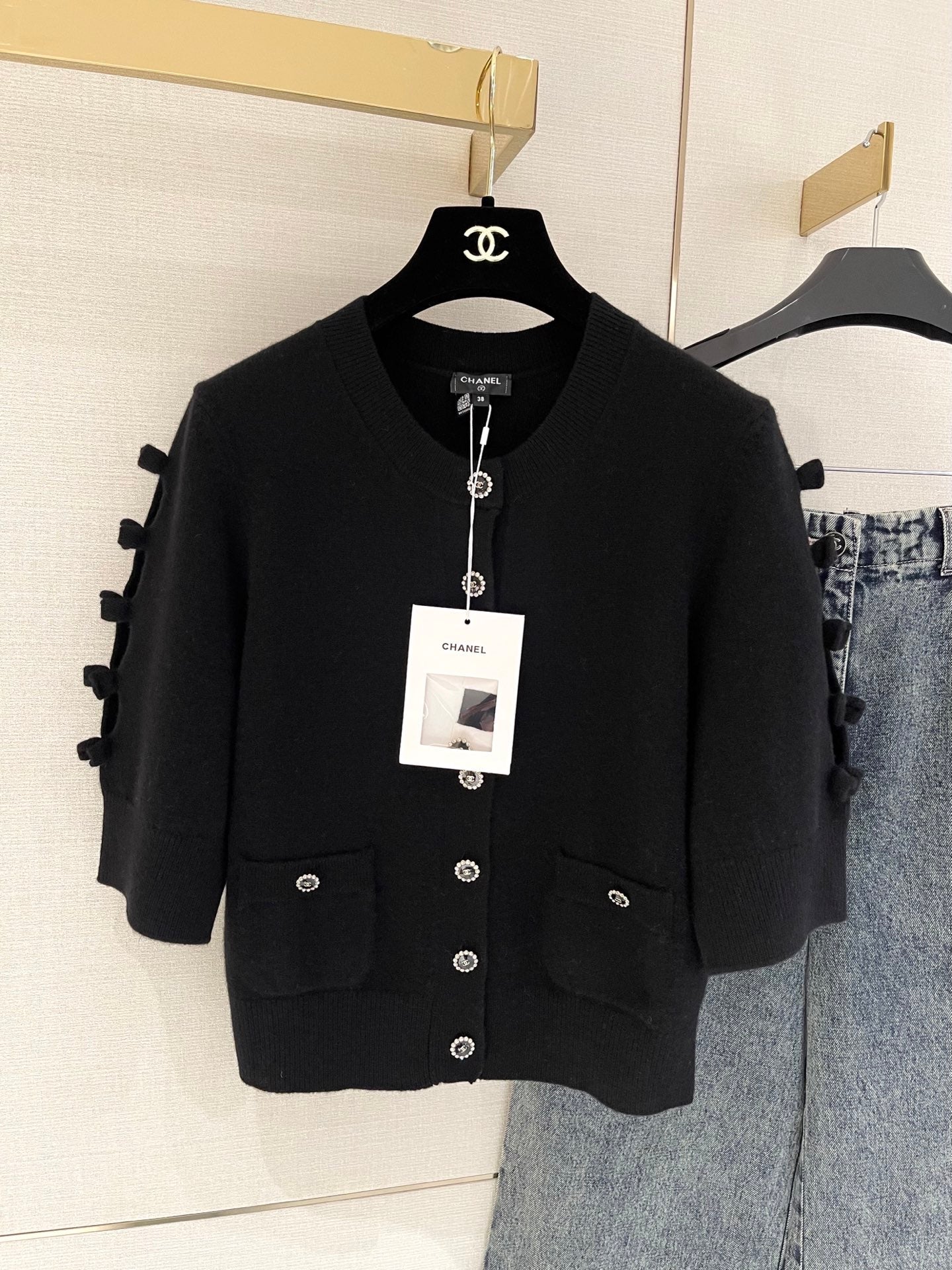 Bow-tie openwork cashmere cardigan with short sleeves