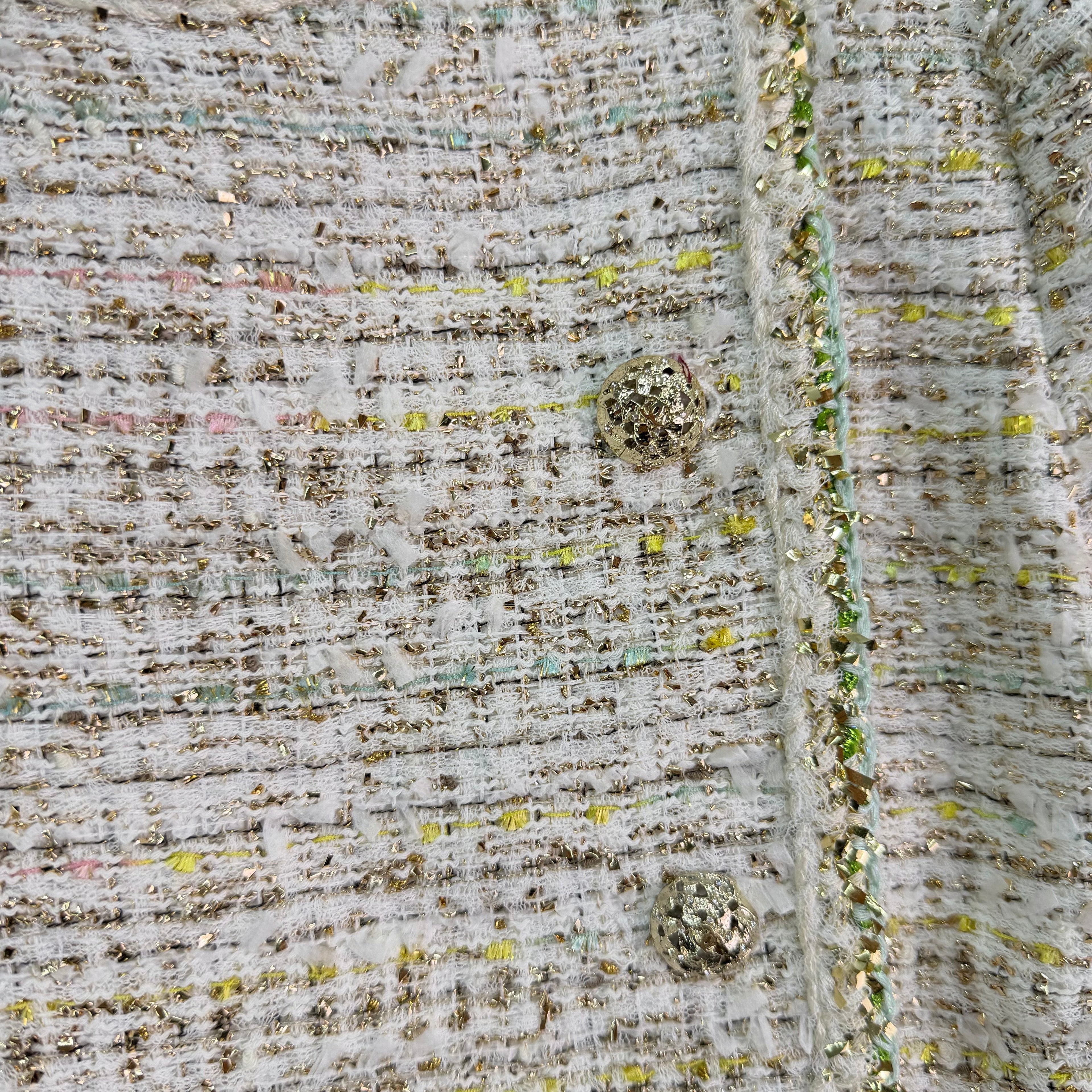 A light beige tweed blend short-sleeved jacket
