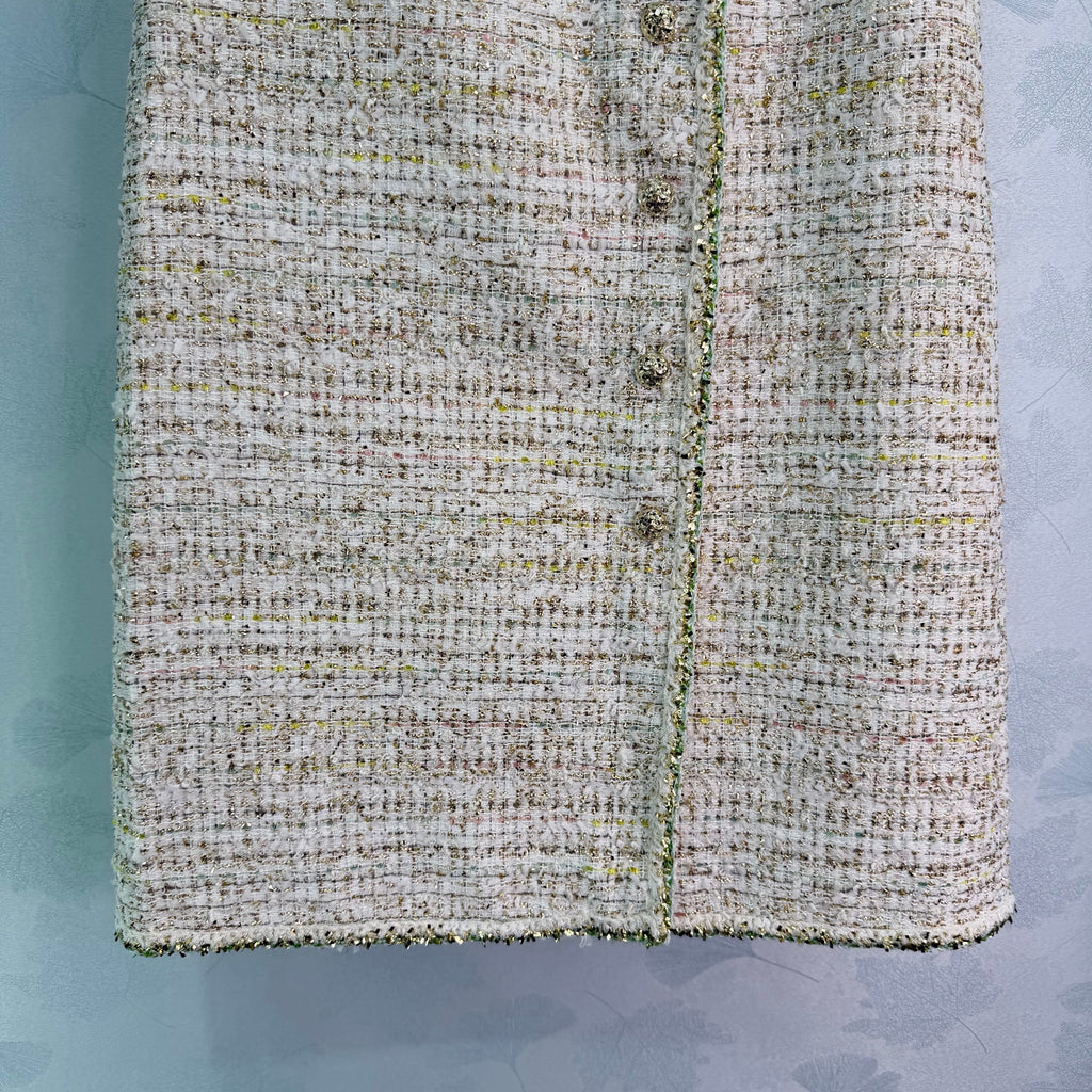 A light beige tweed blend short-sleeved jacket