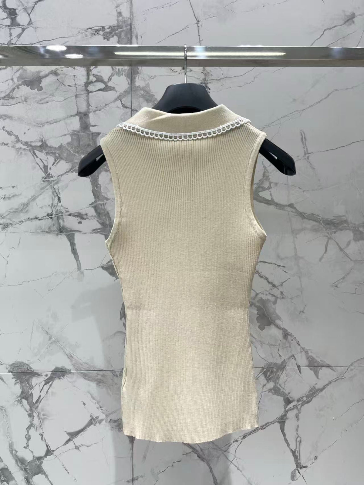 Open-knit vest with a Peter Pan collar