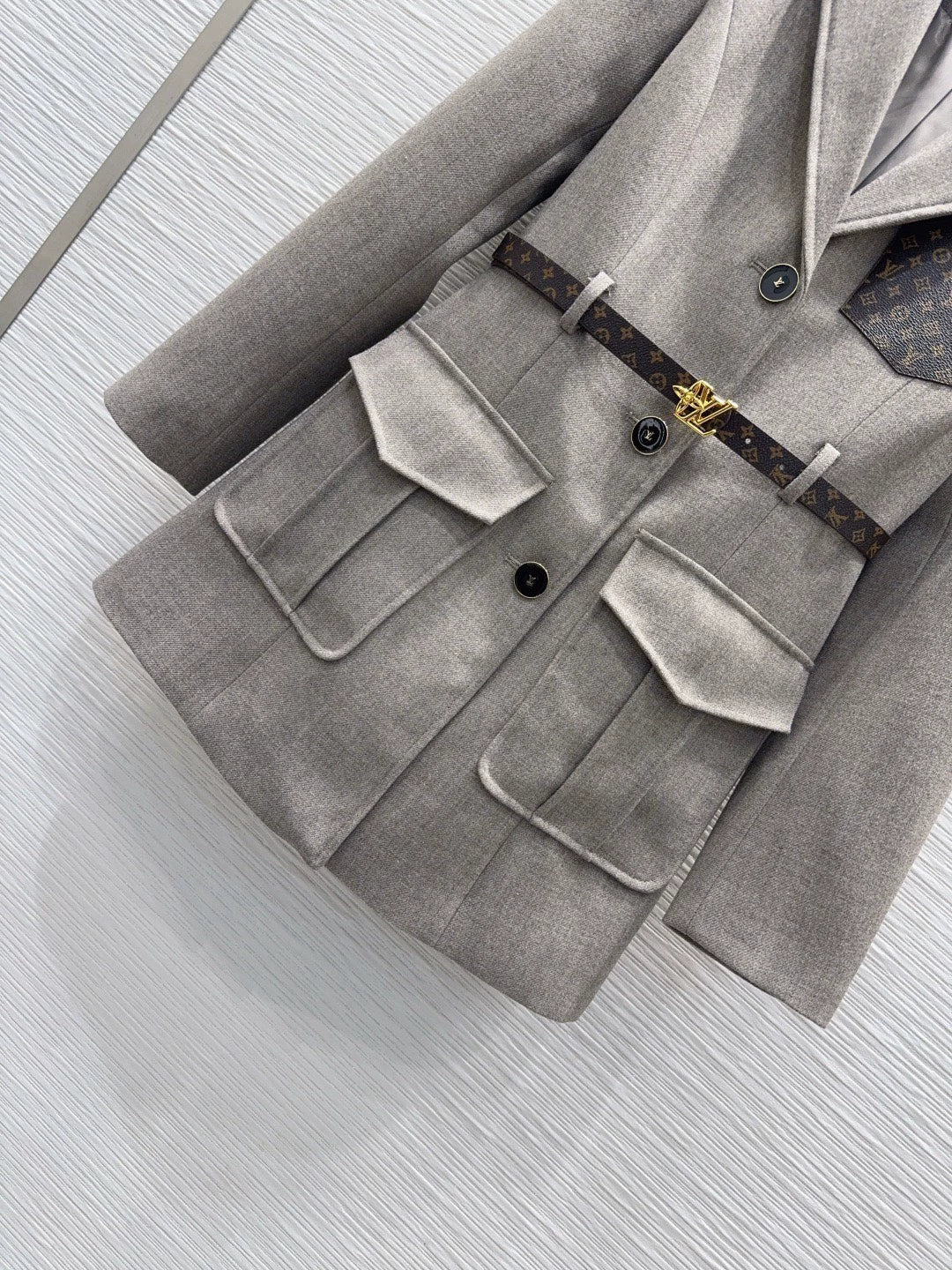 26Long-Sleeve Blazer with Contrast-Color Logo, Pockets, and Waist Belt