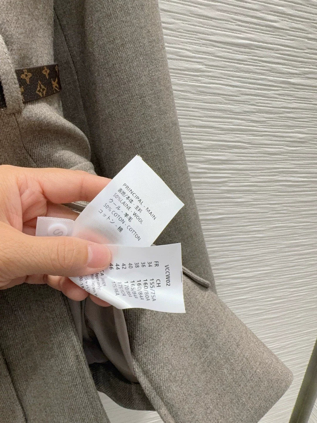 26Long-Sleeve Blazer with Contrast-Color Logo, Pockets, and Waist Belt