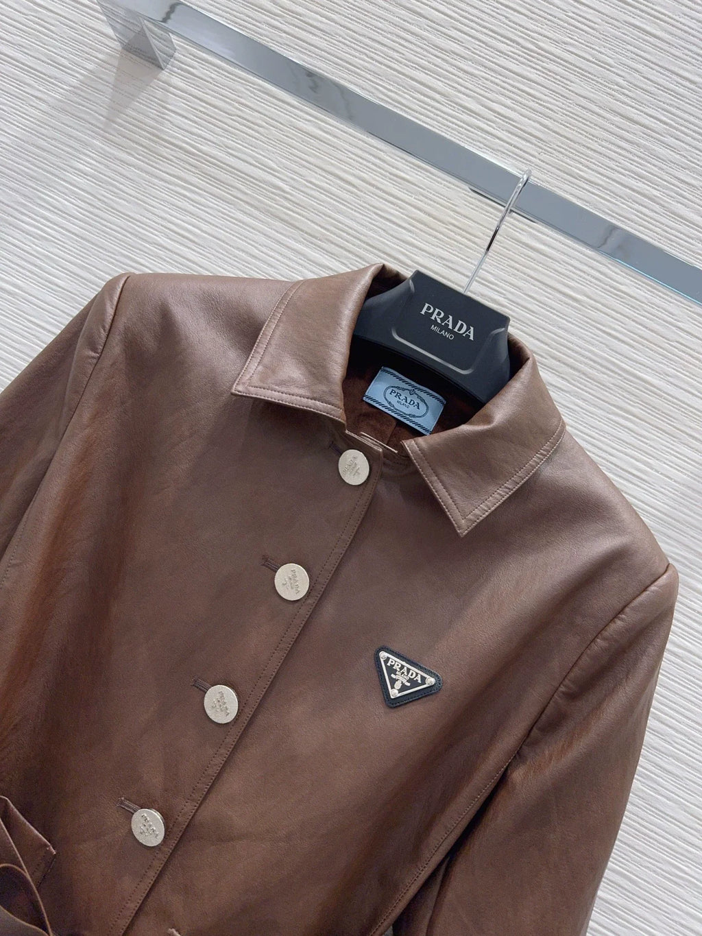 26Long-Sleeve PU Leather Jacket with Triangular Logo and Belt