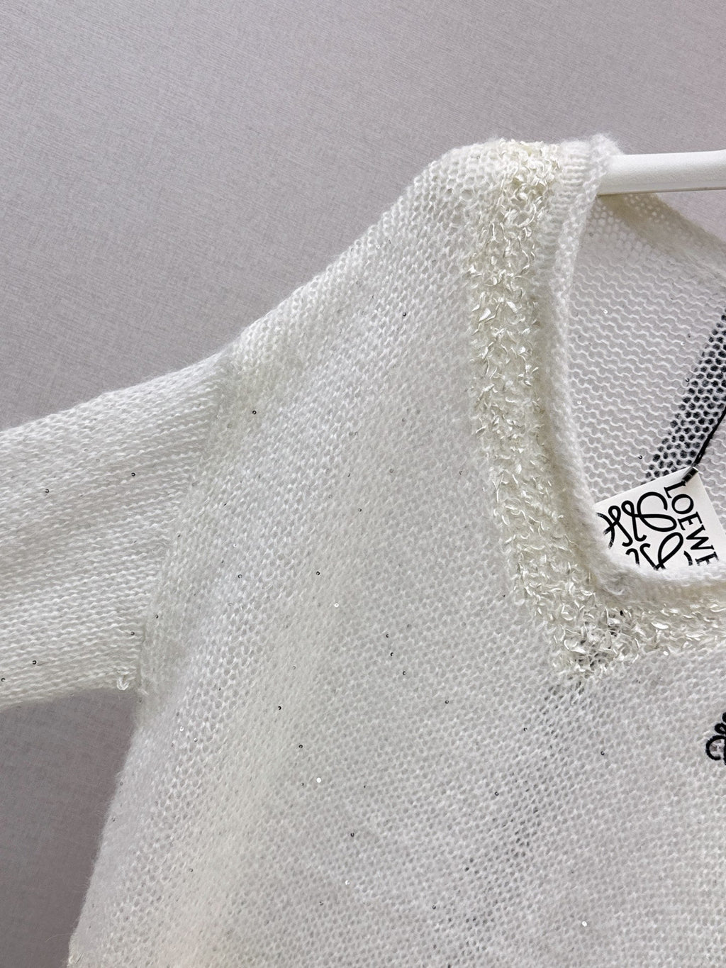 26FW Long-sleeve knit top with cut-out detail and new logo embroidery 🤍